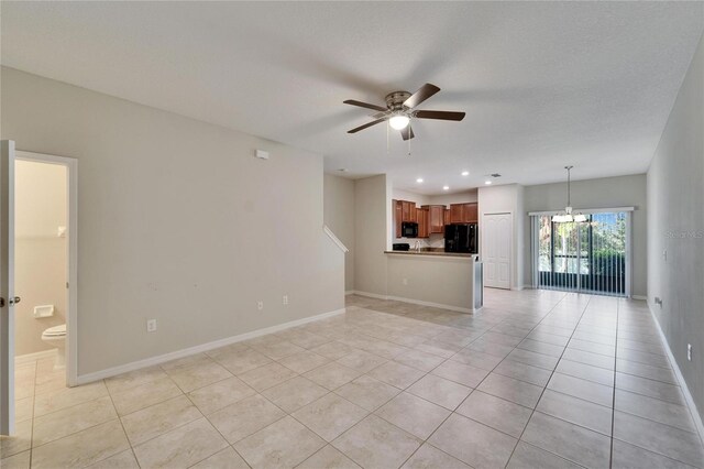 12973 Dream Catcher Way, Riverview, FL 33579 - unfurnished living room with light tile patterned floors, a textured ceiling, and ceiling fan