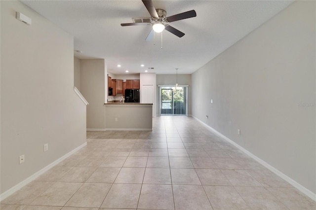 12973 Dream Catcher Way, Riverview, FL 33579 - unfurnished living room featuring ceiling fan with notable chandelier and light tile patterned floors