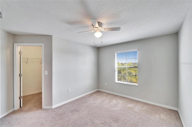 12973 Dream Catcher Way, Riverview, FL 33579 - spare room with light carpet, a textured ceiling, and ceiling fan
