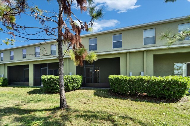 12973 Dream Catcher Way, Riverview, FL 33579 - view of front facade featuring a sunroom and a front yard