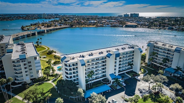 birds eye view of property with a water view