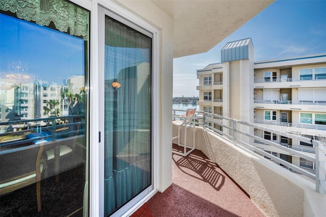 balcony featuring a water view