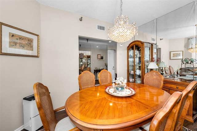 dining area with a notable chandelier