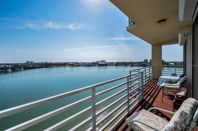 balcony featuring a water view