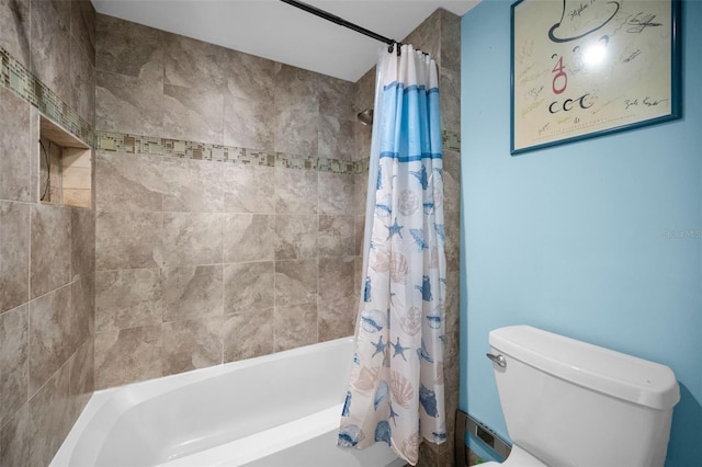 bathroom with shower / tub combo with curtain and toilet