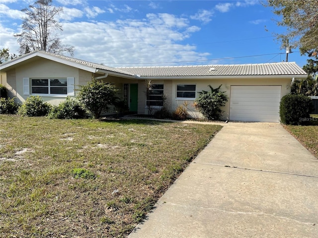 ranch-style house with a garage and a front lawn