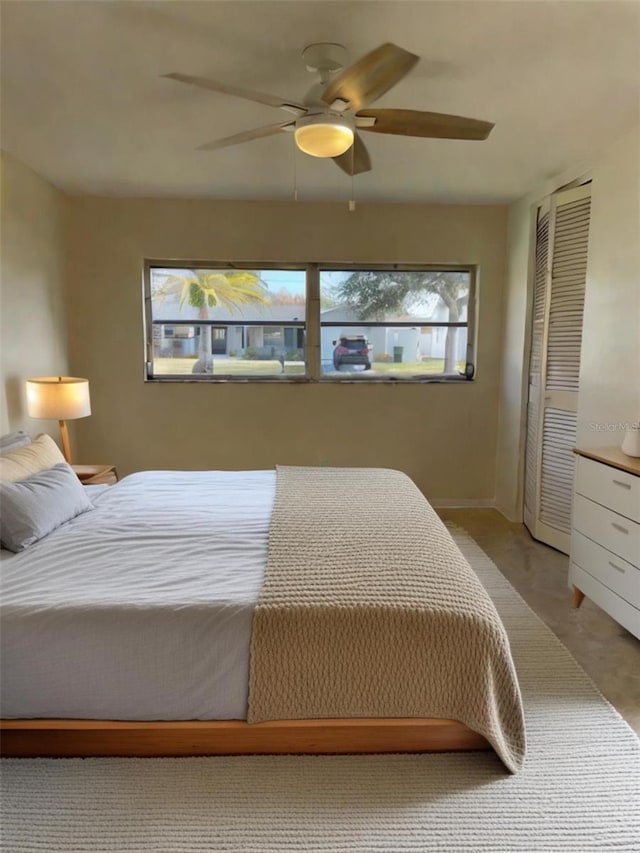 bedroom with multiple windows and ceiling fan