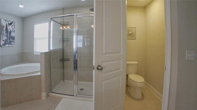 bathroom featuring tile patterned floors, toilet, and independent shower and bath