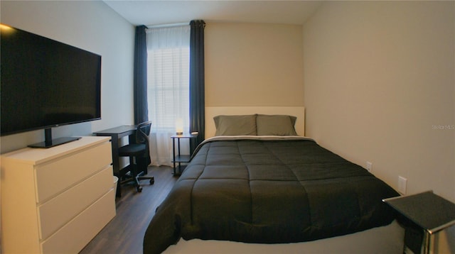 bedroom featuring dark hardwood / wood-style flooring