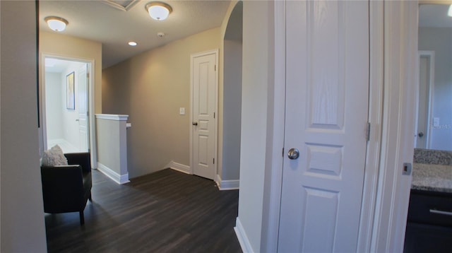 hallway featuring dark hardwood / wood-style flooring