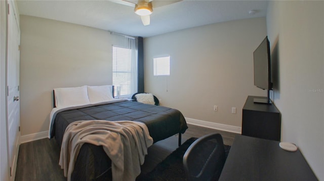 bedroom featuring dark hardwood / wood-style flooring and ceiling fan