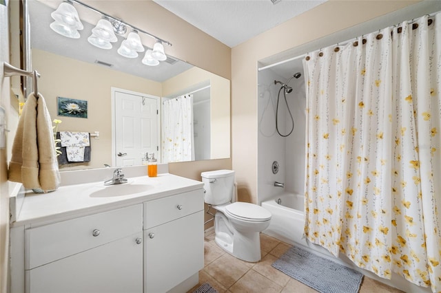 full bathroom with tile patterned floors, toilet, shower / tub combo, a textured ceiling, and vanity