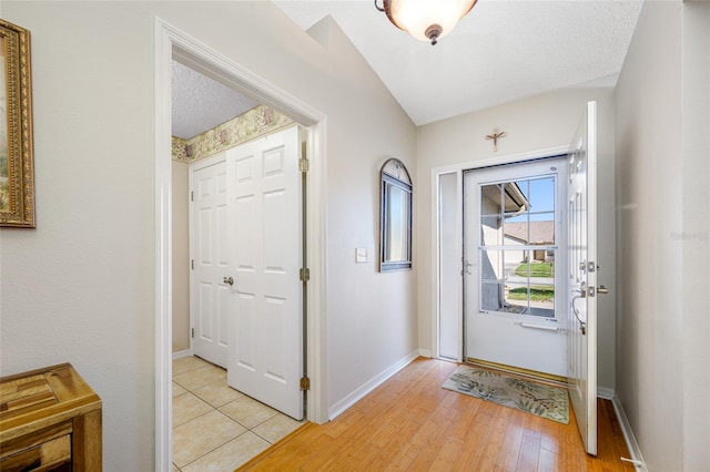 entrance foyer featuring light hardwood / wood-style flooring and a textured ceiling