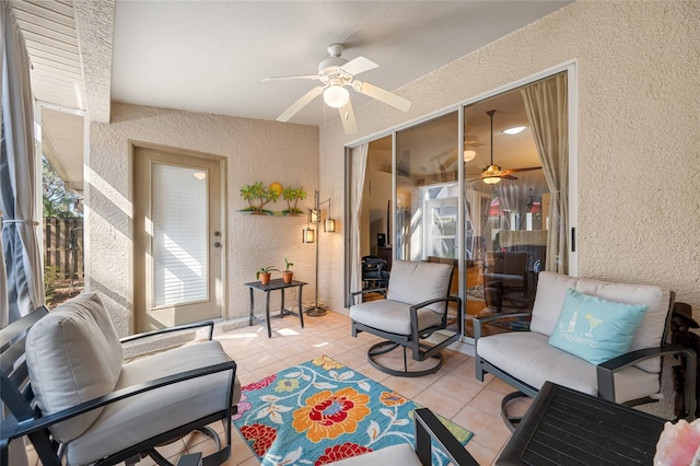 interior space with ceiling fan and light tile patterned flooring