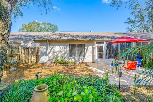 rear view of house featuring a patio