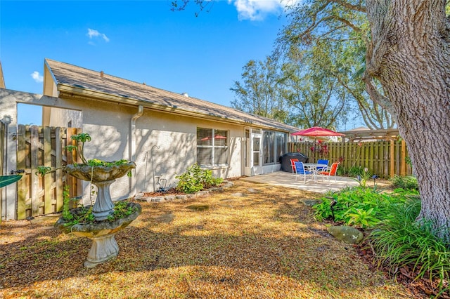 back of property with a patio area