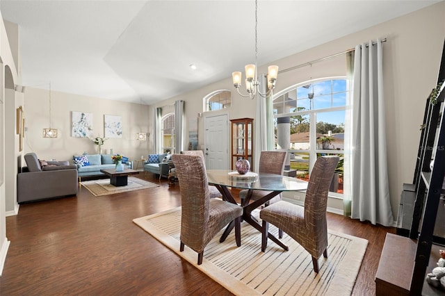 dining space featuring a chandelier and dark wood-type flooring