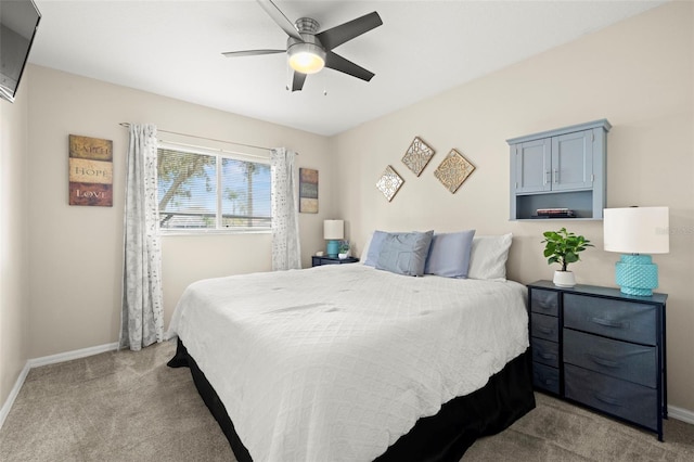 bedroom with light carpet and ceiling fan