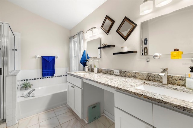 bathroom with vanity, lofted ceiling, and a washtub