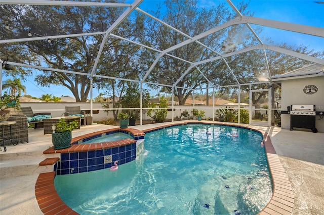 view of swimming pool with a lanai, area for grilling, and a patio area