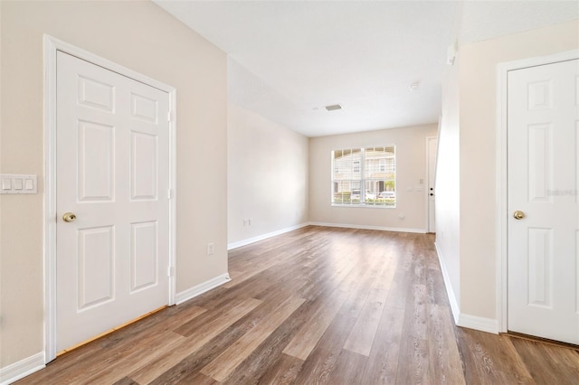 empty room featuring wood-type flooring