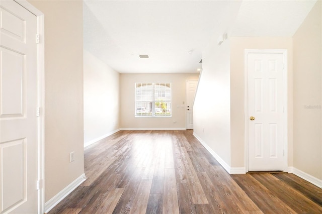 spare room featuring dark hardwood / wood-style flooring