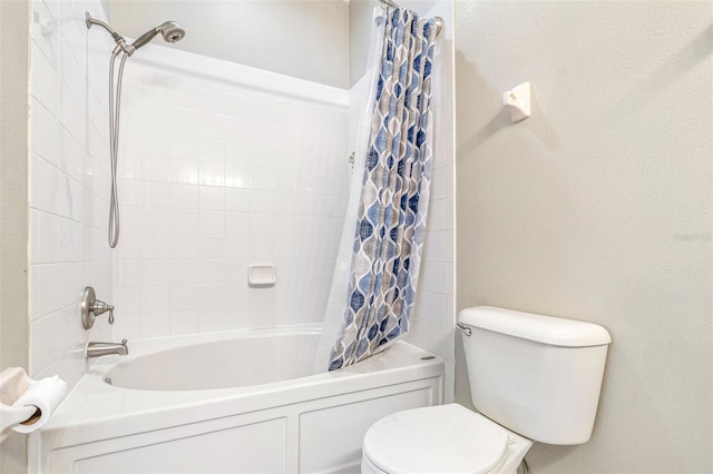 bathroom featuring shower / bathtub combination with curtain and toilet