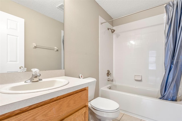 full bathroom with vanity, tile patterned floors, a textured ceiling, and toilet