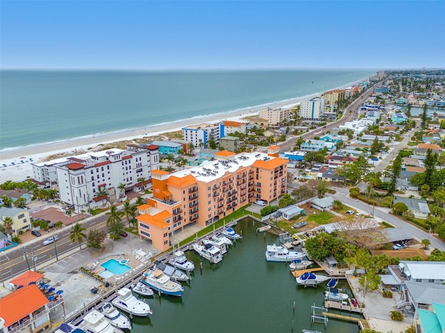 drone / aerial view featuring a water view and a view of the beach