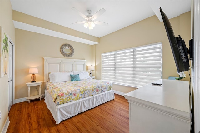 bedroom with hardwood / wood-style floors and ceiling fan