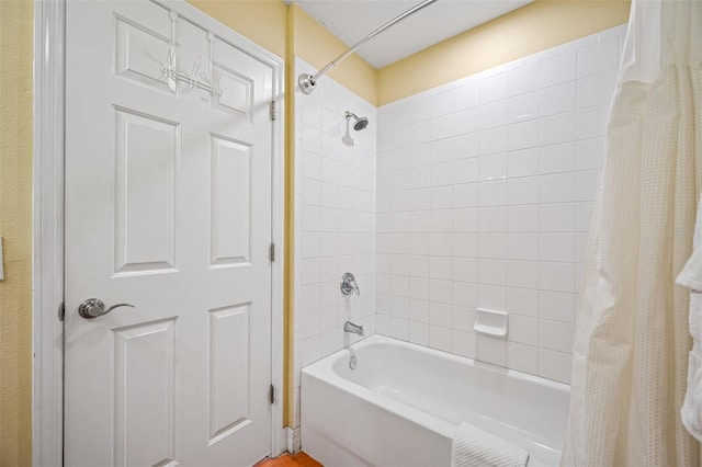 bathroom featuring shower / bathtub combination with curtain