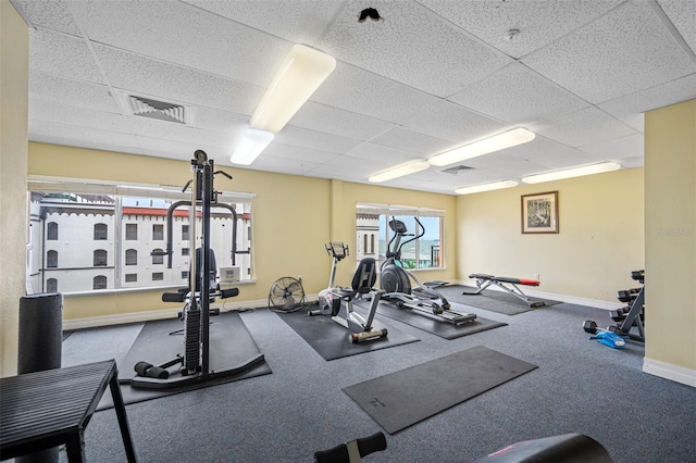 workout area with a paneled ceiling