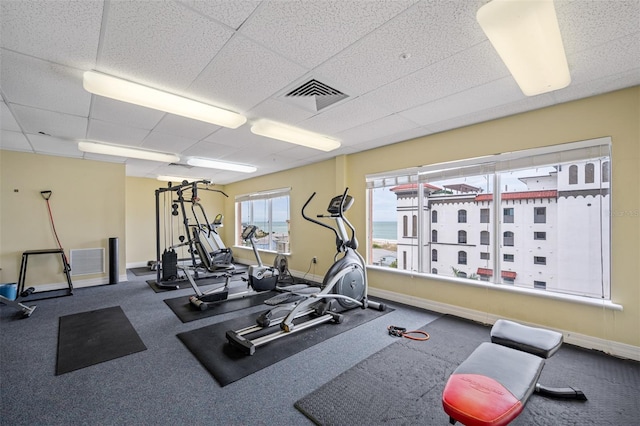 workout area with a drop ceiling