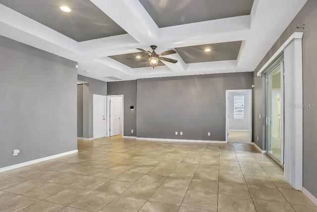 empty room featuring light tile patterned flooring, ceiling fan, coffered ceiling, and beam ceiling