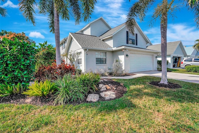 front facade with a garage and a front lawn