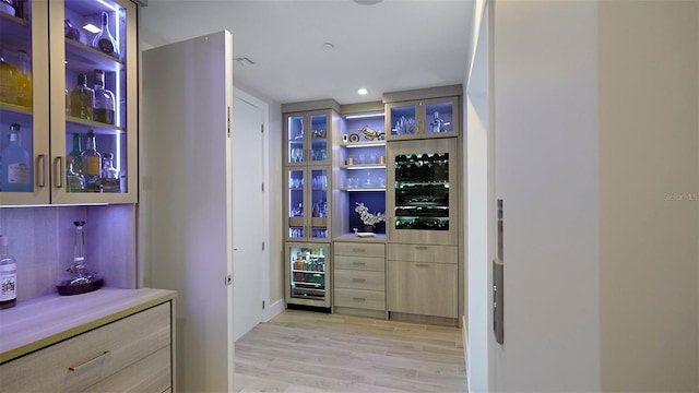 interior space featuring light hardwood / wood-style flooring and light brown cabinets