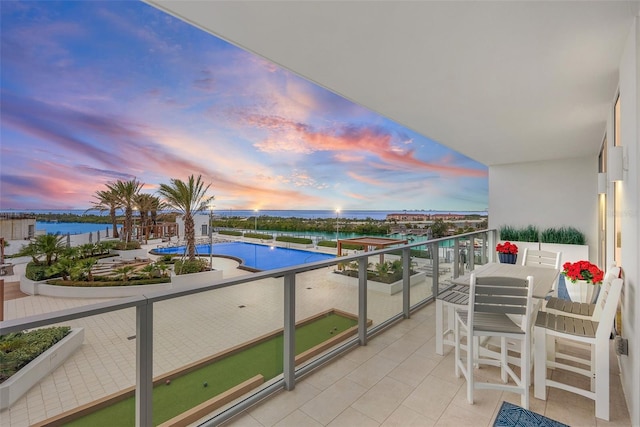 balcony at dusk with a water view