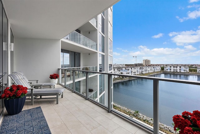 balcony featuring a water view