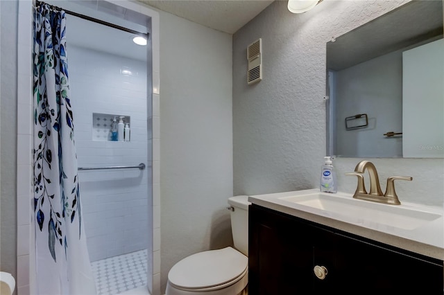 bathroom with walk in shower, vanity, and toilet