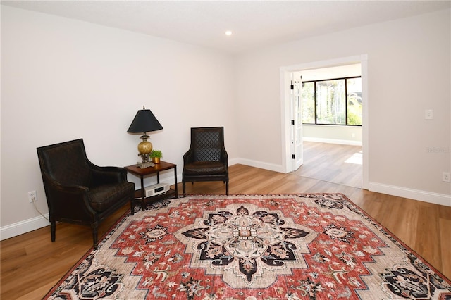 sitting room featuring hardwood / wood-style floors