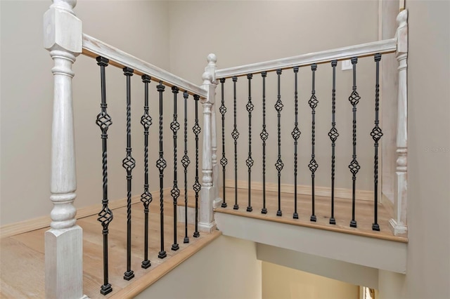 stairs featuring wood-type flooring