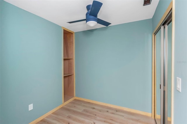 unfurnished bedroom featuring light hardwood / wood-style flooring, a closet, and ceiling fan