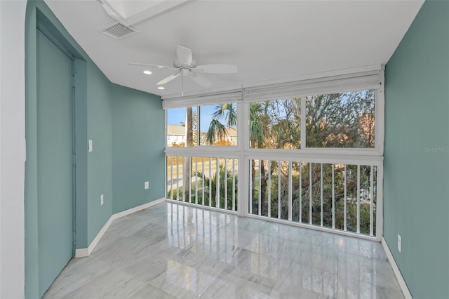 sunroom / solarium with ceiling fan