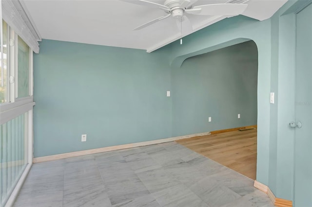 unfurnished room with ceiling fan and light wood-type flooring