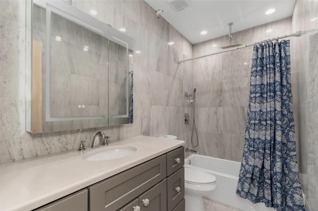 full bathroom featuring vanity, toilet, and shower / bath combo