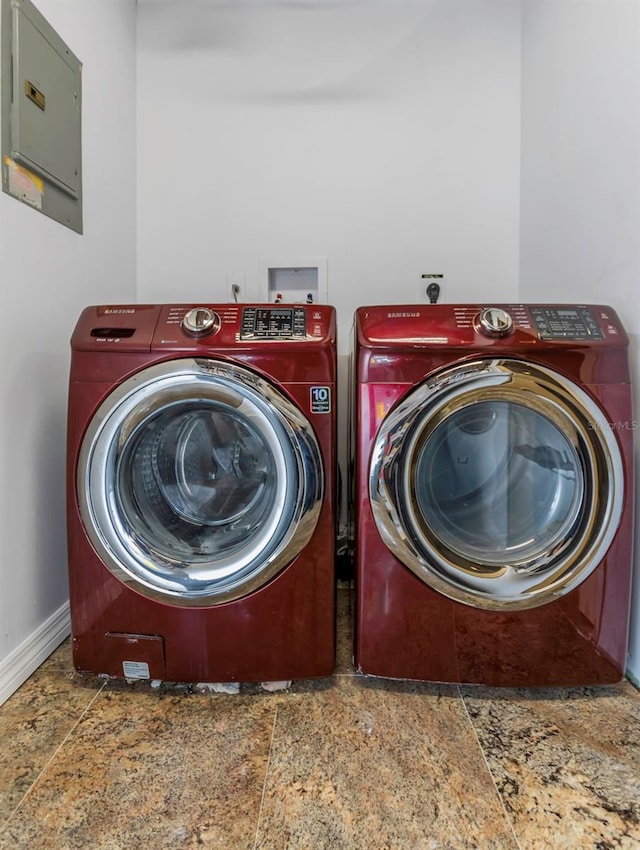 washroom featuring independent washer and dryer and electric panel