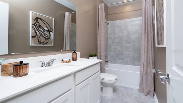 full bathroom with tile patterned flooring, shower / bath combo, vanity, and toilet