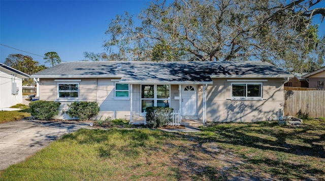 ranch-style home with a front yard