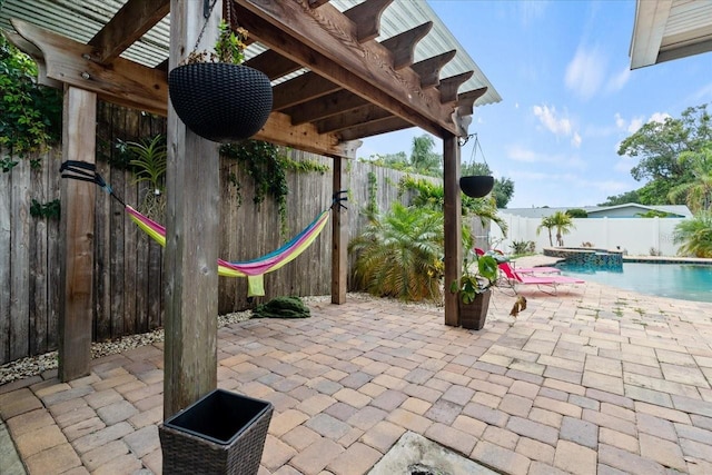 view of patio / terrace with a fenced in pool and a pergola