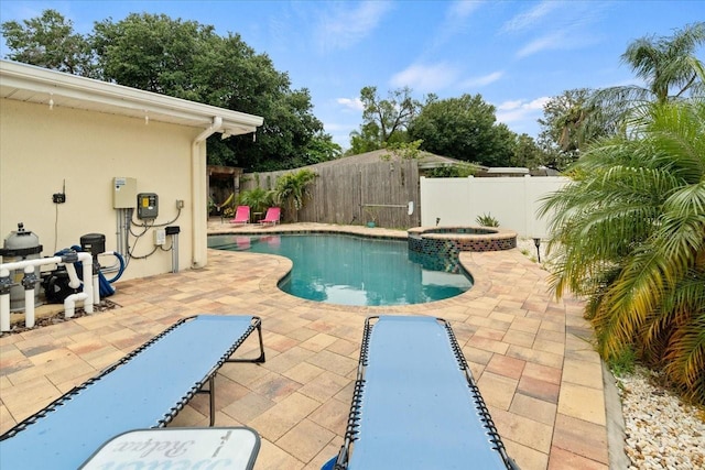 view of pool featuring an in ground hot tub and a patio